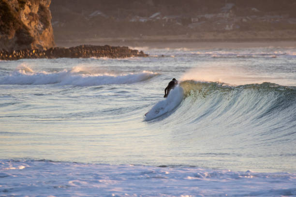 istock Surfer on Blue & green Ocean Wave riding a surfboard 1255102518