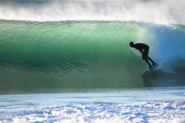 istock Surfer on Blue & green Ocean Wave riding a surfboard 1255102520