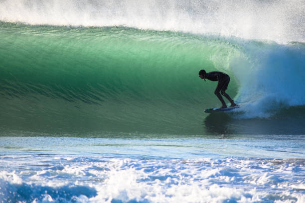 istock Surfer on Blue & green Ocean Wave riding a surfboard 1255102541
