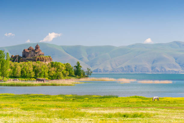 Beautiful picturesque landscape - view of Lake Sevan, a monastery in Armenia