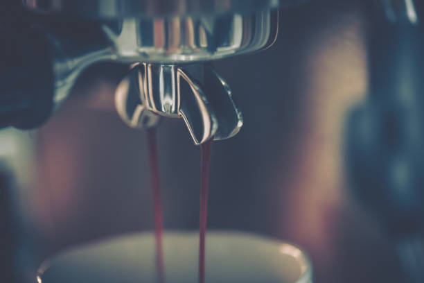 Barista using coffee machine; close-up