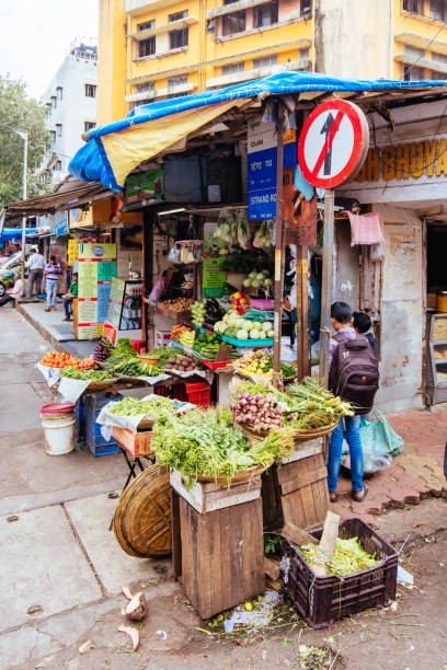Mumbai, India - August 5 2017: Fresh fruit and vegetables at a market stall in Colaba Causeway Market in Mumbai, India