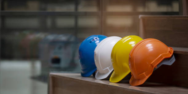 istock Multicolored Safety Construction Worker Hats. Teamwork of the construction team must have quality. Whether it is engineering, construction workers. Have a helmet to wear at work. For safety at work. 1255110522