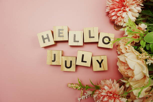 istock Hello July alphabet letter with space copy on pink background 1255115671