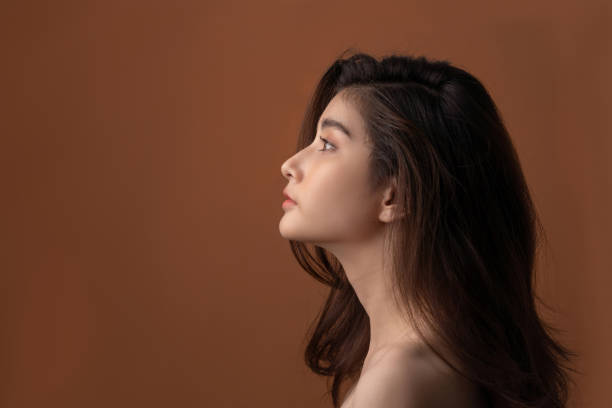 istock Beautiful asian woman with a beautiful face . Side view 1255119117