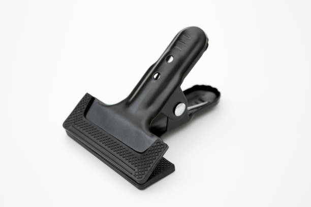 istock Black clamp used in industry on a white backgrou 1255119925