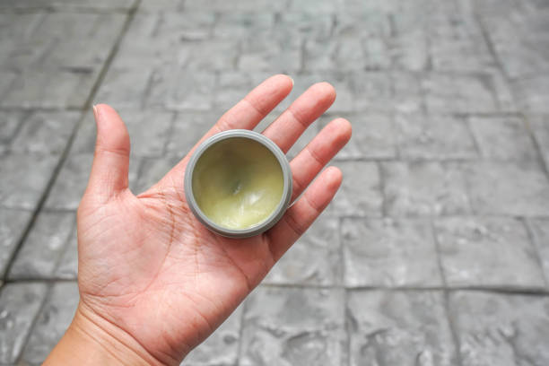istock people left hand hold setting wax product in for hair styling 1255125132