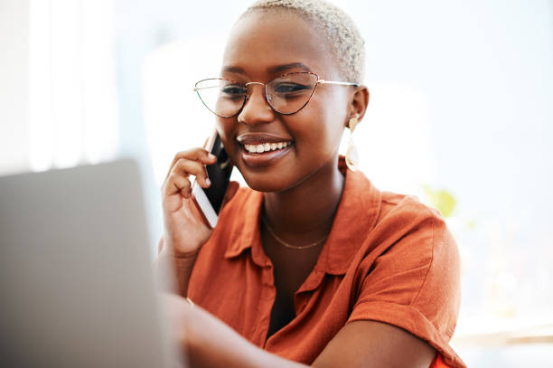 istock Liaising with her client over the phone 1255135831