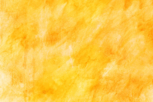 istock Creative beautiful bright yellow background, cracks and scratches on the concrete. Grungy concrete surface. Great background or texture for your project. 1255137392
