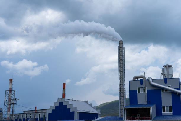 istock Factory polluting the atmosphere with smoke from production 1255139056