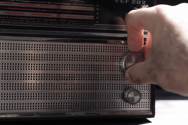 istock Old radio on wooden background 1255139176