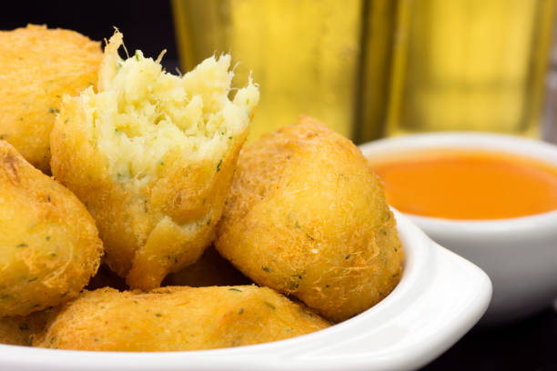 istock Traditional recipe codfish balls in a pub table with one open in close 1255140109