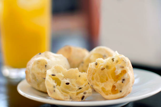 Traditional Brazilian snack cheese bread in multigrain version in a bistro table