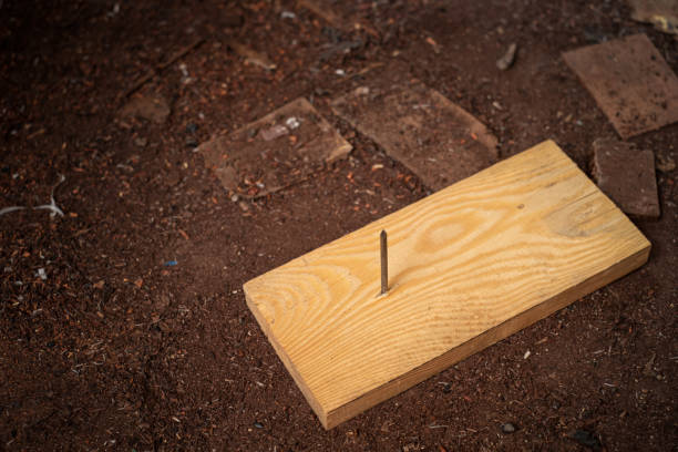 Nail steel on board wood In the construction area