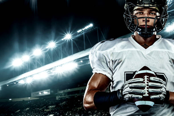 American football player, in helmet on stadium. Sport action concept. stock photo