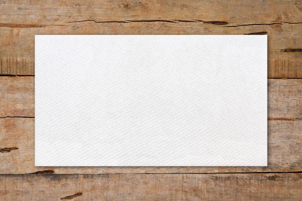 istock Tissue paper mockup on brown wooden table 1255149924