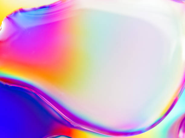 istock Abstract composition. Drops of liquid are on an iridescent surface. Slightly defocused image. Trending background of saturated colors and gradients. 1255150719