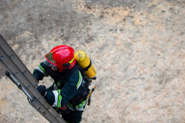 istock Firefighter climbs the stairs. Lifeguard training. 1255150794
