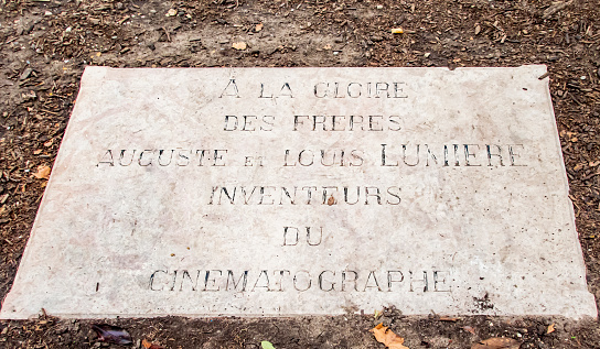 This is a commemorative plaque on the street where the very first moving picture image was created by the Lumiere brothers. It commemorates Louis and Auguste Lumiere as the inventors of cinematography.