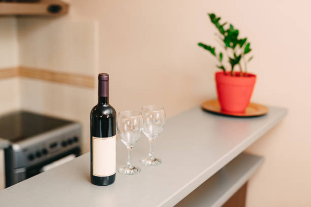red wine is in wine glass on dinner table with bookeh effect vertical food and drink business still