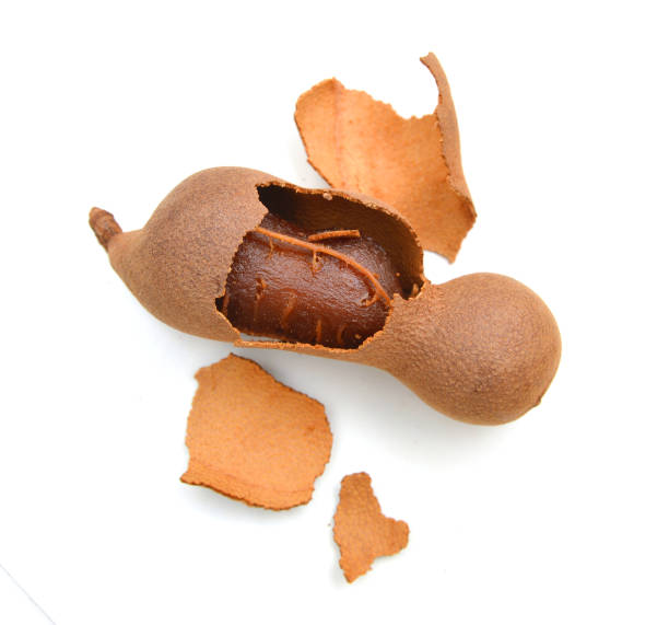 istock ripe tamarind fruits isolated on a white background 1255167895