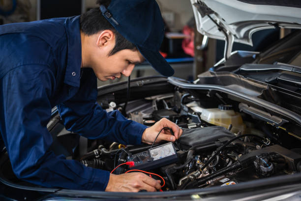 istock male mechanics check electrical wiring vehicle system in car service 1255167921