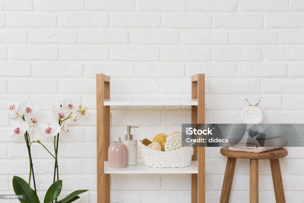Shelving unit with spa products and copy space in center Bathroom Stock Photo
