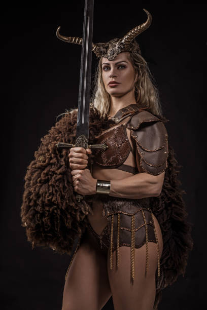 istock Blonde viking warrior female in studio shot 1255170549