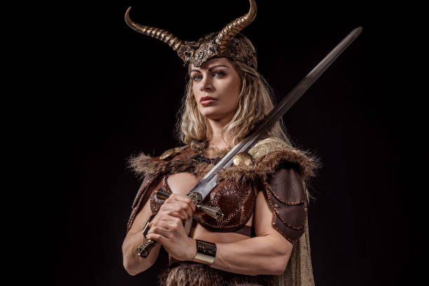 istock Blonde viking warrior female in studio shot 1255170586