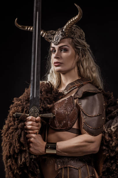 istock Blonde viking warrior female in studio shot 1255170605