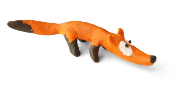 istock Cute fox made of plasticine isolated on white background. 1255171922