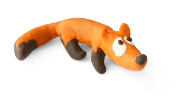istock Cute fox made of plasticine isolated on white background. 1255171936