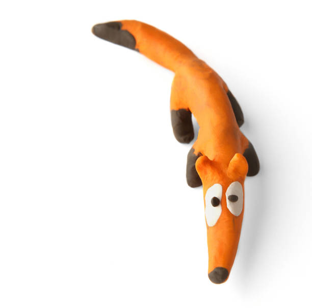 istock Cute fox made of plasticine isolated on white background. 1255171948