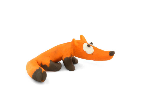istock Cute fox made of plasticine isolated on white background. 1255171956