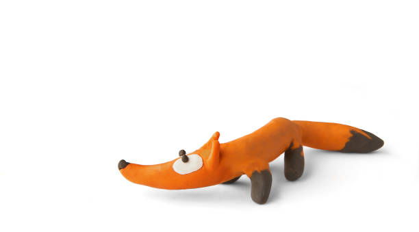 istock Cute fox made of plasticine isolated on white background. 1255171971