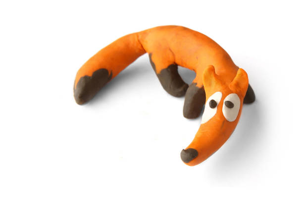 istock Cute fox made of plasticine isolated on white background. 1255171994