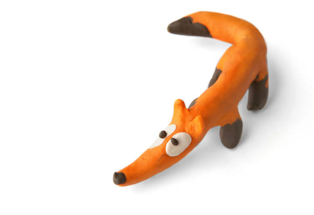 istock Cute fox made of plasticine isolated on white background. 1255172010