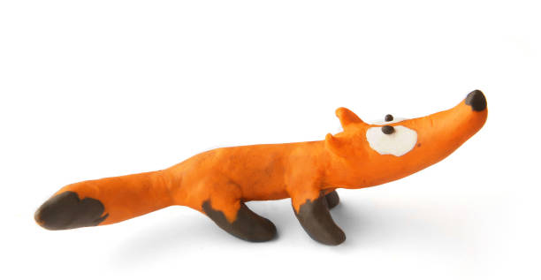 istock Cute fox made of plasticine isolated on white background. 1255172061