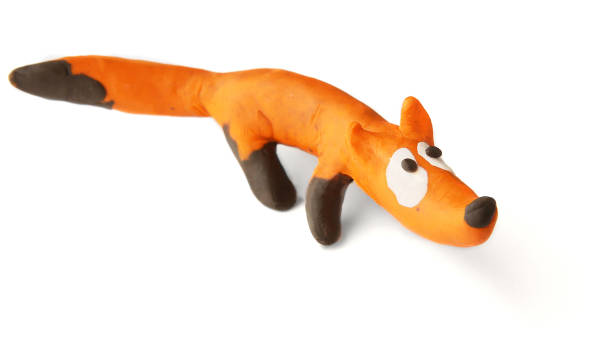 istock Cute fox made of plasticine isolated on white background. 1255172069