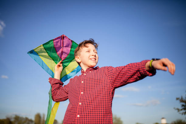 istock Teenager launches a kite 1255173078