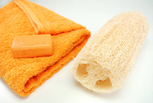 istock Natural shower sponge, soap and towel in white background 1255173764