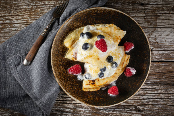 istock Pancakes with white cheese and fruit. 1255175713