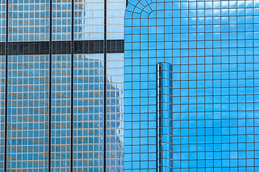 Madrid, Spain - October 6, 2021: Architectural detail, glass facades of the modern skyscrapers that are part of the Cuatro Torres Business Area in Madrid, Spain