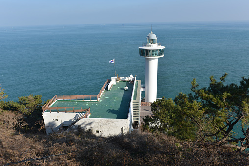 Taejongdae lighthouse taken during the day on Feb 6, 2020. This was taken during winter in the early afternoon with the sea as the background and the lighthouse in the foreground.