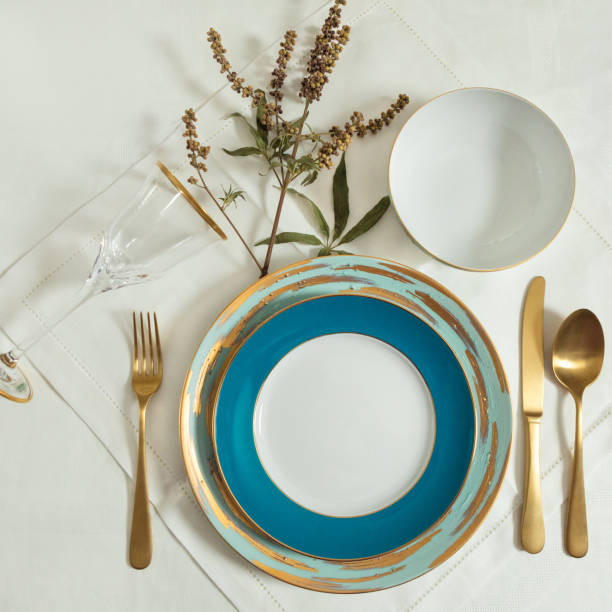 istock Set of clean tableware, dishes, plates, utensils on the table 1255180312