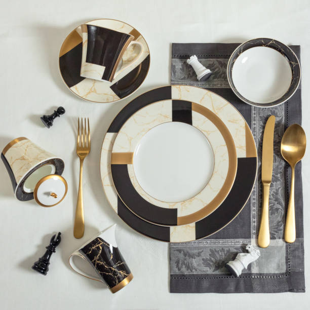 istock Set of clean tableware, dishes, plates, utensils on the table 1255180323