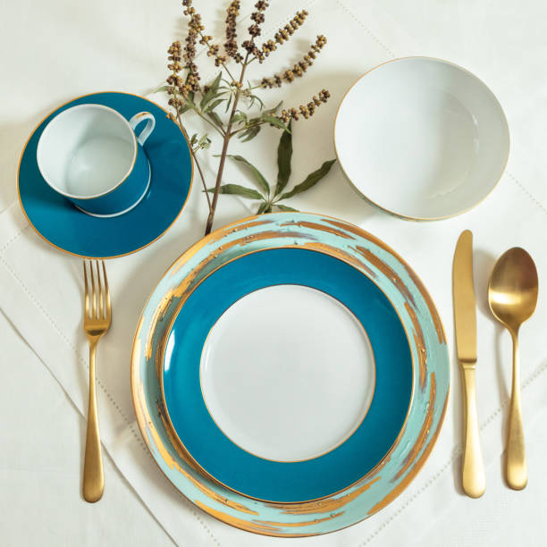istock Set of clean tableware, dishes, plates, utensils on the table 1255180400