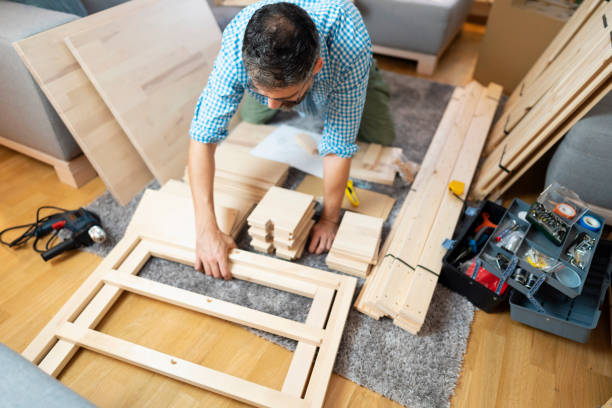 handyman assembling furniture for new home - instrument of measurement organization housing project housing development imagens e fotografias de stock