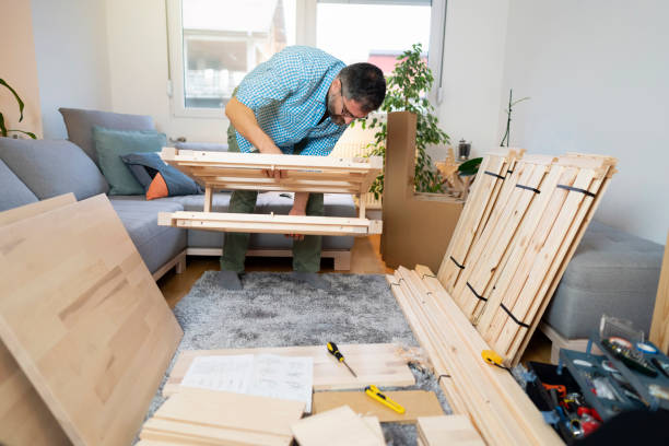 istock Handyman installing furniture at home 1255180549