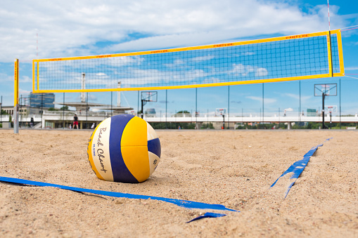 Beach volleyball, sports and man diving for ball, outdoor game or nature training for athletic challenge, action or match. Mockup blue sky, sand and player workout, activity and exercise in Australia